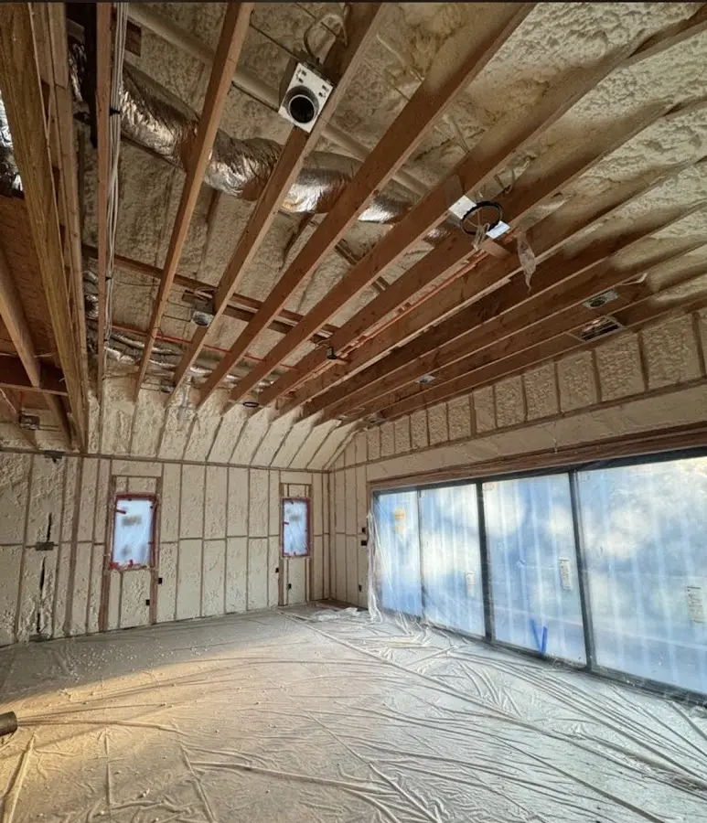 Interior walls and ceiling insulated with spray foam during new construction in Tupelo